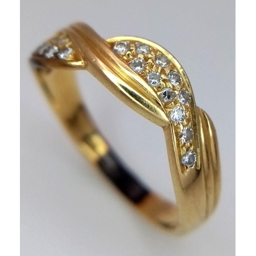 94 - An 18K Gold Diamond Crossover Ring. 22 small round cut diamonds. Size S. 4.2g total weight. ref: STK... 