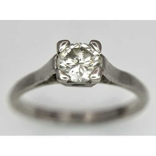 99 - An 18K White Gold Ring Diamond Solitaire Ring. 0.65ct brilliant round cut diamond. Size N. 3.4g tota... 