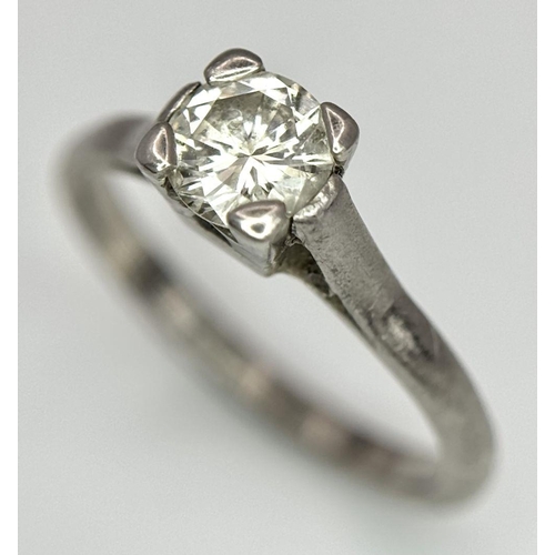 99 - An 18K White Gold Ring Diamond Solitaire Ring. 0.65ct brilliant round cut diamond. Size N. 3.4g tota... 