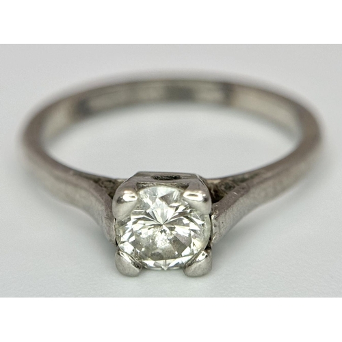 99 - An 18K White Gold Ring Diamond Solitaire Ring. 0.65ct brilliant round cut diamond. Size N. 3.4g tota... 