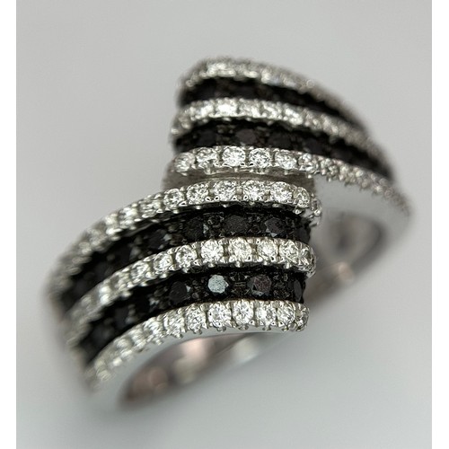 50 - A 14K WHITE GOLD, BLACK AND WHITE DIAMOND CROSSOVER RING. SOPHISTICATED, LOVELY DESIGN. 7.8G. SIZE N... 