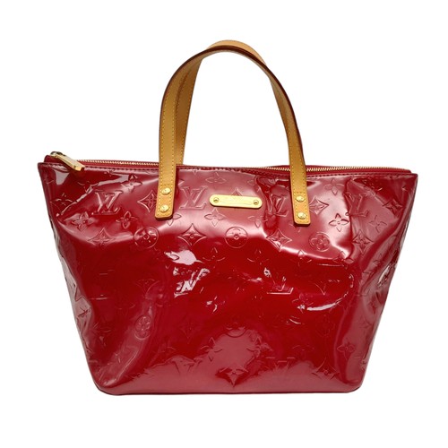 82 - A Louis Vuitton Red Vernis Alma PM Bag. Vernis leather exterior with gold-toned hardware, dual top h... 