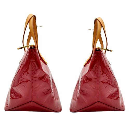 82 - A Louis Vuitton Red Vernis Alma PM Bag. Vernis leather exterior with gold-toned hardware, dual top h... 