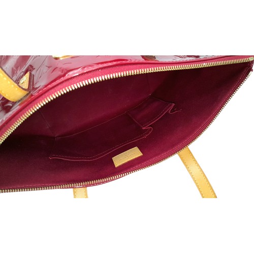 82 - A Louis Vuitton Red Vernis Alma PM Bag. Vernis leather exterior with gold-toned hardware, dual top h... 