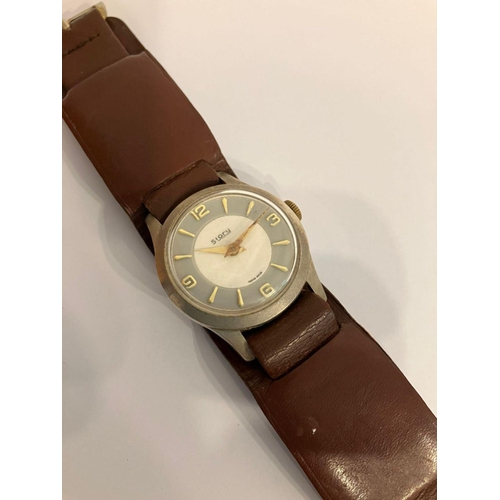 637 - Gentleman’s rare vintage ‘STORY’ WRISTWATCH. Swiss made. Complete with brown leather trench style st... 