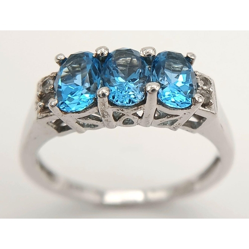 1013 - A Sterling Silver, Blue and White Topaz Set Ring Size O. The Ring is Set with 6mm Long Oval Cut Blue... 