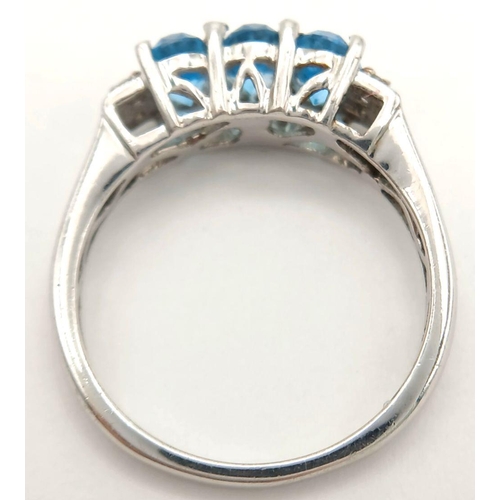 1013 - A Sterling Silver, Blue and White Topaz Set Ring Size O. The Ring is Set with 6mm Long Oval Cut Blue... 