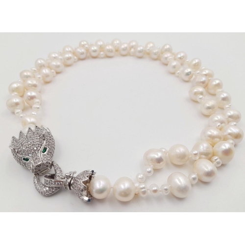 105 - A stunning, highly glamorous, two strand cultured pearl necklace and bracelet set with extraordinary... 