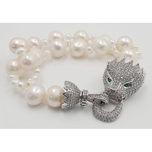 105 - A stunning, highly glamorous, two strand cultured pearl necklace and bracelet set with extraordinary... 