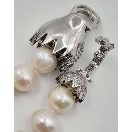 105 - A stunning, highly glamorous, two strand cultured pearl necklace and bracelet set with extraordinary... 