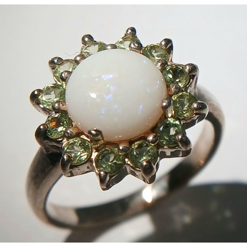 1062 - A Vintage Sterling Silver Opal and Peridot Set Ring Size J. The Ring Measures 1.5cm Wide at the Crow... 