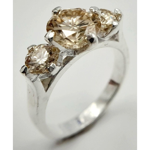 1063 - A 925 silver three-stone ring with 2.5ct round-cut moissanite. Ring size O, total weight: 4.3g. Come... 