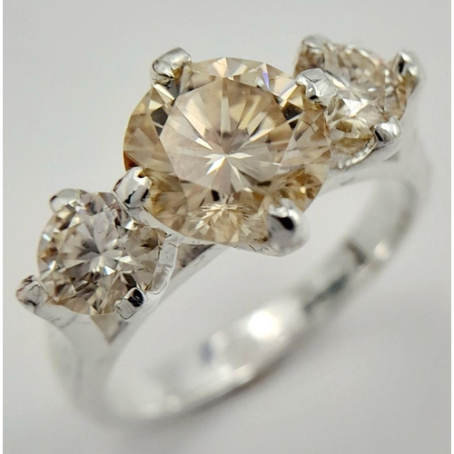 1063 - A 925 silver three-stone ring with 2.5ct round-cut moissanite. Ring size O, total weight: 4.3g. Come... 