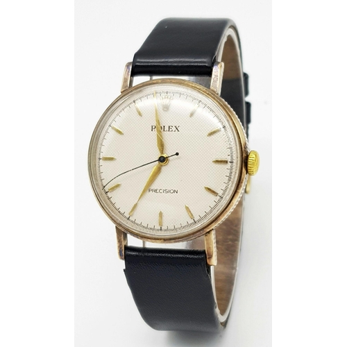 155 - A Vintage 1957 Rolex Precision 9K Gold Cased Gents Watch. Hand wind movement. Black leather strap wi... 