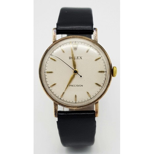 155 - A Vintage 1957 Rolex Precision 9K Gold Cased Gents Watch. Hand wind movement. Black leather strap wi... 