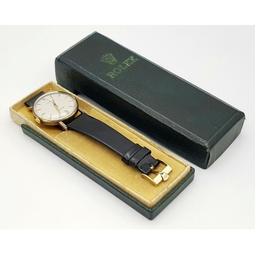 155 - A Vintage 1957 Rolex Precision 9K Gold Cased Gents Watch. Hand wind movement. Black leather strap wi... 