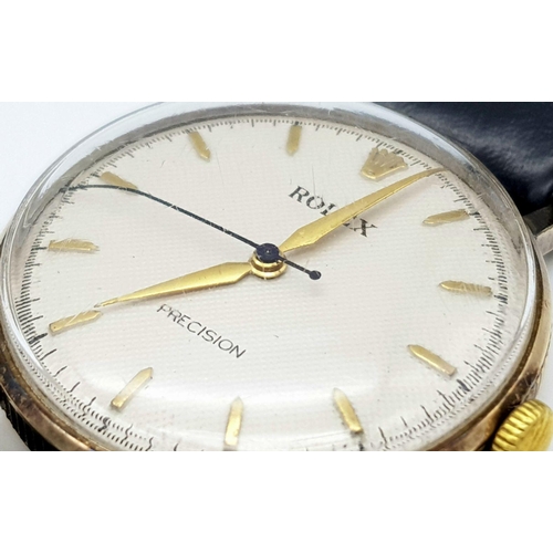 155 - A Vintage 1957 Rolex Precision 9K Gold Cased Gents Watch. Hand wind movement. Black leather strap wi... 