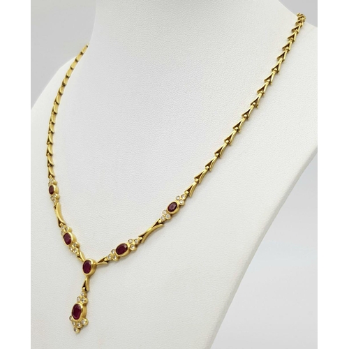 259 - A Gorgeous 18K Yellow Gold Ruby and Diamond Necklace. Arrowhead links sit amongst six oval rubies an... 