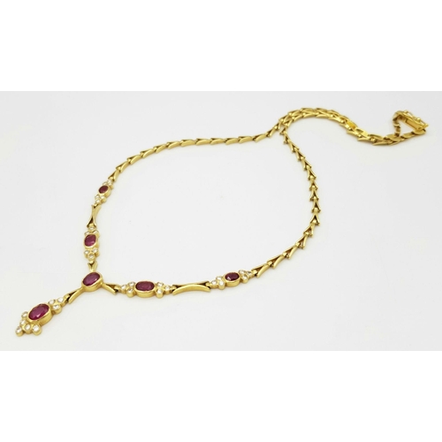 259 - A Gorgeous 18K Yellow Gold Ruby and Diamond Necklace. Arrowhead links sit amongst six oval rubies an... 