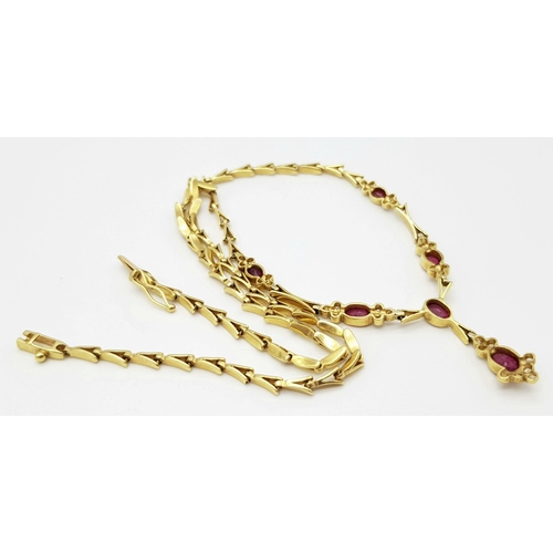 259 - A Gorgeous 18K Yellow Gold Ruby and Diamond Necklace. Arrowhead links sit amongst six oval rubies an... 