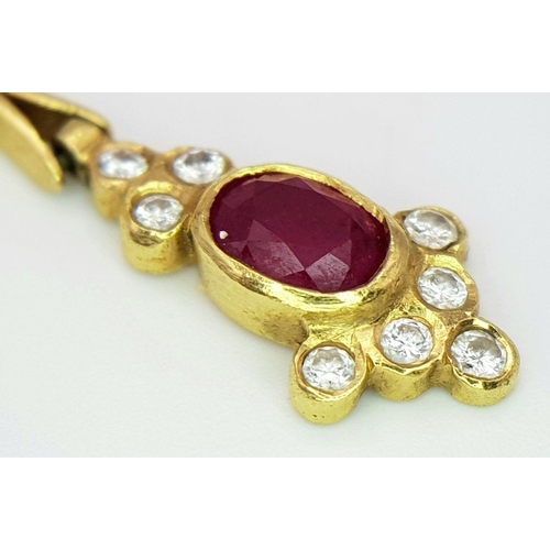 259 - A Gorgeous 18K Yellow Gold Ruby and Diamond Necklace. Arrowhead links sit amongst six oval rubies an... 