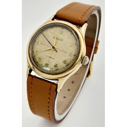 261 - A Vintage Rotary 9K Gold Cased Gents Watch. New brown leather strap. 9K gold case - 30mm. Patinaed d... 