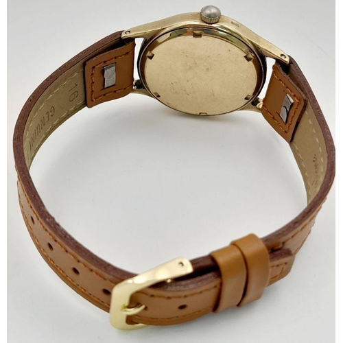 261 - A Vintage Rotary 9K Gold Cased Gents Watch. New brown leather strap. 9K gold case - 30mm. Patinaed d... 