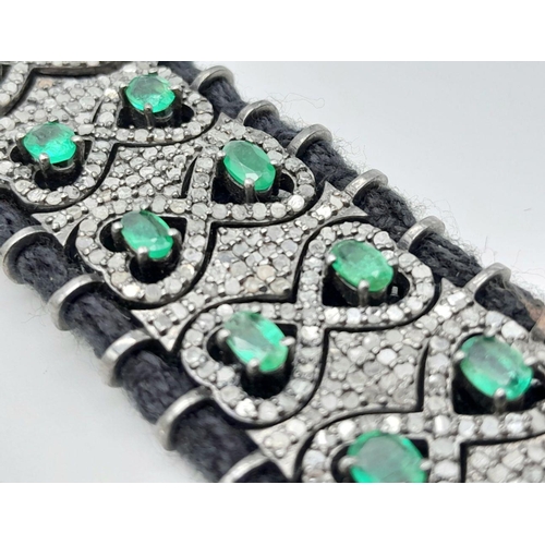 297 - A beautifully handcrafted bracelet embossed with  approx 6.10ct diamonds and 7.20cts Emeralds, set i... 