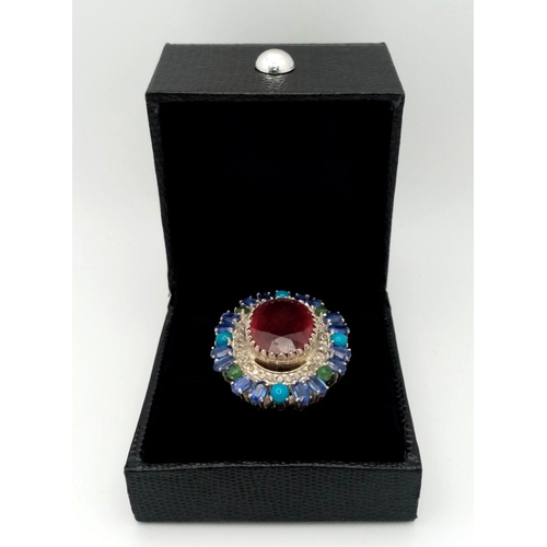 304 - A 925 silver ring with a 15ct central ruby, accented by 12ct opals and 1.50ct diamonds. Ring size O.... 