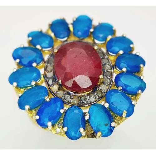 338 - A gorgeous cocktail ring with a 7ct central ruby, surrounded by 4ct blue opals and 0.15ct diamonds, ... 