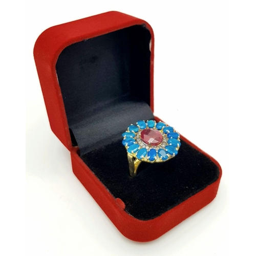 338 - A gorgeous cocktail ring with a 7ct central ruby, surrounded by 4ct blue opals and 0.15ct diamonds, ... 