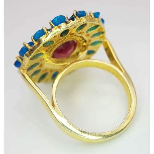 338 - A gorgeous cocktail ring with a 7ct central ruby, surrounded by 4ct blue opals and 0.15ct diamonds, ... 