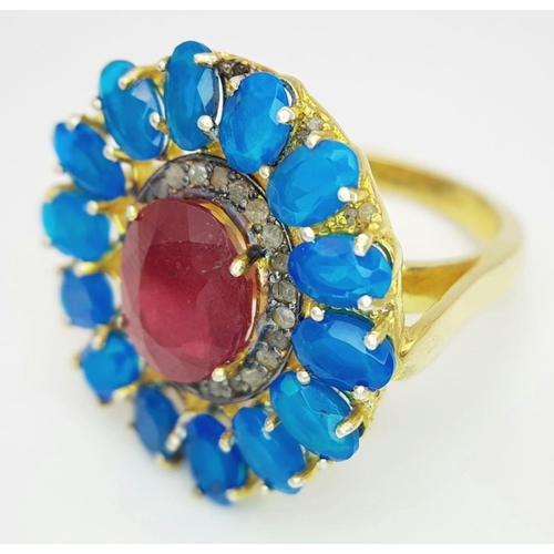 338 - A gorgeous cocktail ring with a 7ct central ruby, surrounded by 4ct blue opals and 0.15ct diamonds, ... 