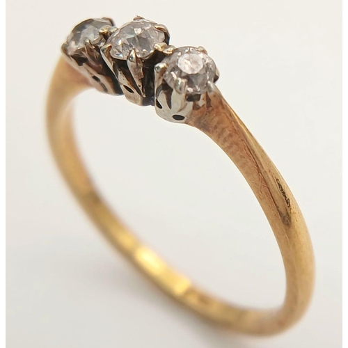 390 - A 18K yellow gold diamond trilogy ring, 0.24ct diamond weight, 2.2g total weight, size N 1/2. Ref SH... 