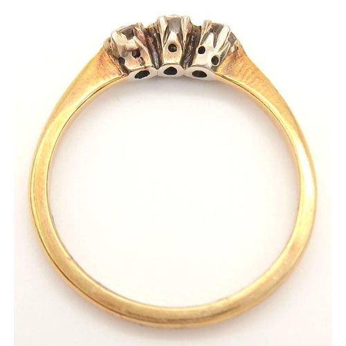 390 - A 18K yellow gold diamond trilogy ring, 0.24ct diamond weight, 2.2g total weight, size N 1/2. Ref SH... 