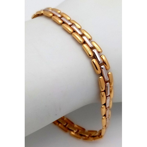 444 - An 18K Yellow and White Gold Flat Link Bracelet. 19cm. 11.9g total weight.