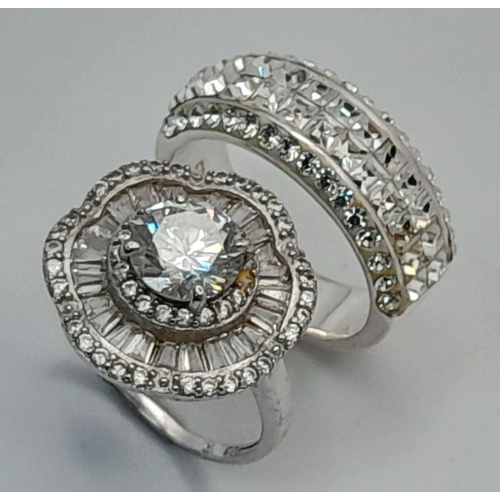 644 - 2 x STUNNING SILVER and ZIRCONIA CLUSTER RINGS. Complete with ring boxes. Both Rings Size L 1/2.  Fl... 