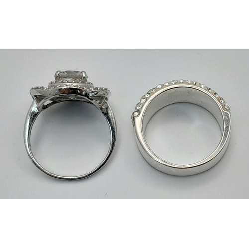 644 - 2 x STUNNING SILVER and ZIRCONIA CLUSTER RINGS. Complete with ring boxes. Both Rings Size L 1/2.  Fl... 