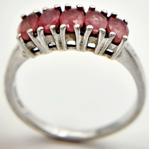 665 - Impressive SILVER and RUBY RING. Having a sweep of 5 x individually mounted RUBIES set to top. Marki... 