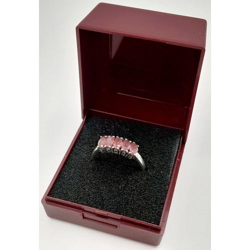 665 - Impressive SILVER and RUBY RING. Having a sweep of 5 x individually mounted RUBIES set to top. Marki... 