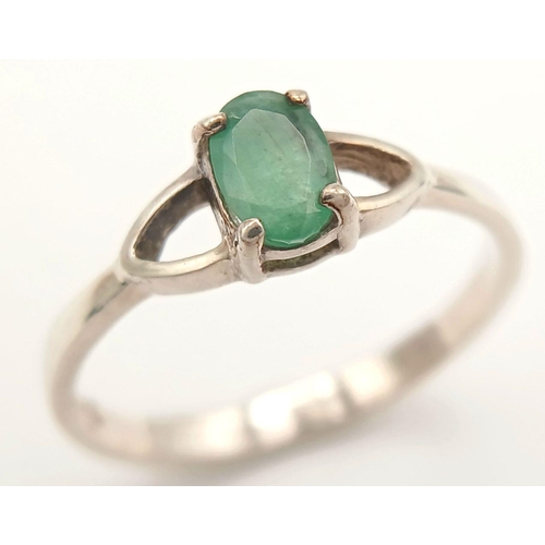 817 - A Sterling Silver and Emerald Solitaire Ring Size N. The Ring is set with a 6mm Oval Cut Emerald and... 