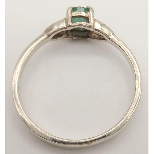 817 - A Sterling Silver and Emerald Solitaire Ring Size N. The Ring is set with a 6mm Oval Cut Emerald and... 