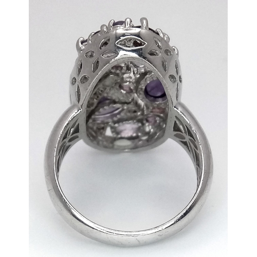 774 - A Sterling Silver, Amethyst and Garnet Set Statement Ring Size S. The Ring Measures 3cm Long at the ... 