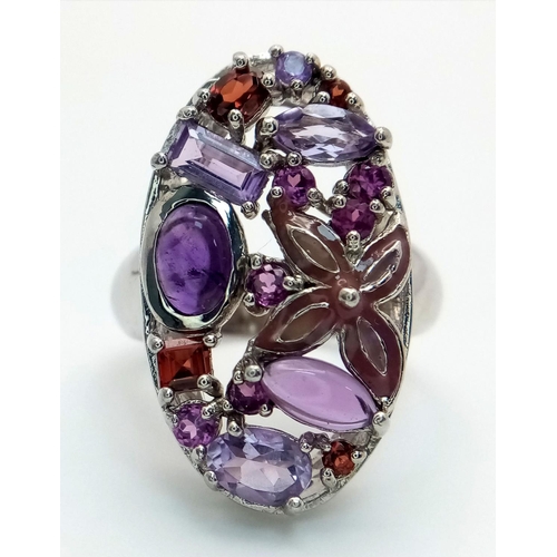 774 - A Sterling Silver, Amethyst and Garnet Set Statement Ring Size S. The Ring Measures 3cm Long at the ... 