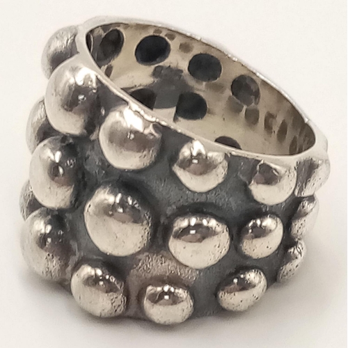 789 - A Vintage Modernist/Brutalist Design Sterling Silver Studded Ring Size R. The Ring Measures 1.9cm Wi... 