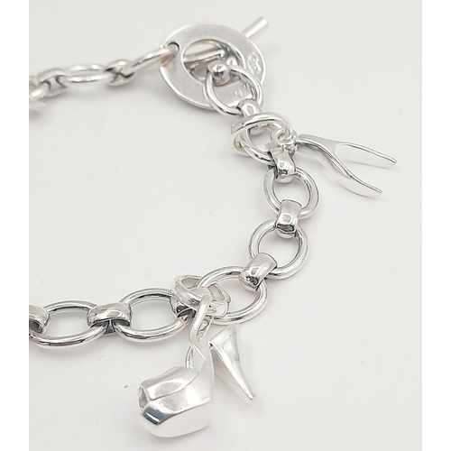 936 - A sterling silver charm bracelet, 28g total weight, 19.4cm total length. Ref SH8673H