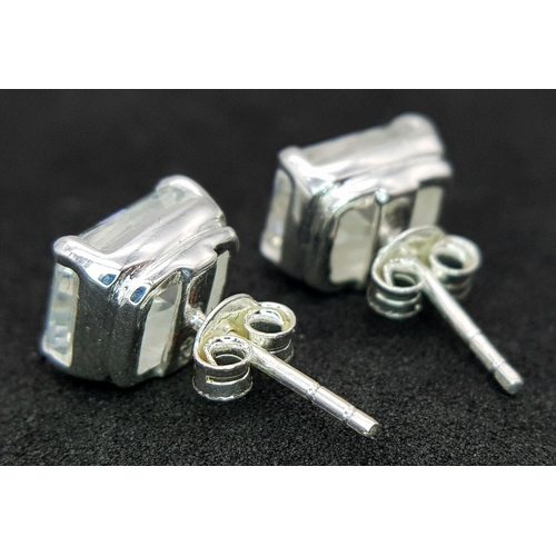 948 - A pair of 925 silver stud earrings set with radiant-cut white moissanite stones. Total weight: 2.9g.... 