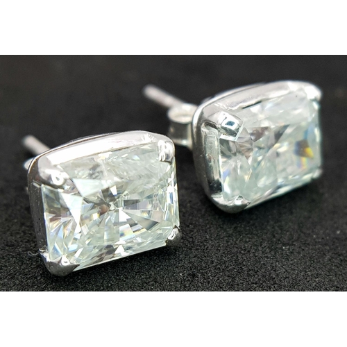 948 - A pair of 925 silver stud earrings set with radiant-cut white moissanite stones. Total weight: 2.9g.... 