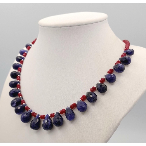 976 - A 925 silver necklace with 185ct ruby gemstones and sapphire drops. Ref: CD - 1552.