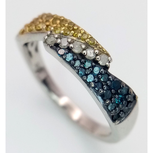 977 - A Sterling Silver Three Colour Diamond Set Ring Size O. The Ring is set with Clear, Yellow and Blue ... 